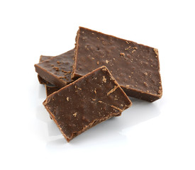 Closeup detail of chocolate parts on white background.