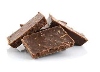 Closeup detail of chocolate parts on white background.