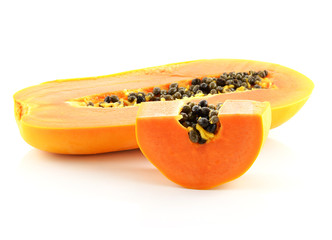 Half cut papaya fruits on white background