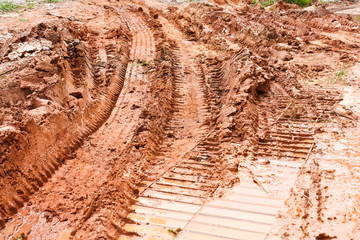 Bulldozer tracks in the dirt