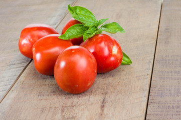Red paste tomatoes on a wooden table