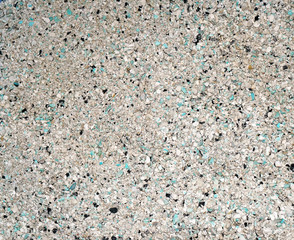 Background of small blue, gray, white and black small granules (
