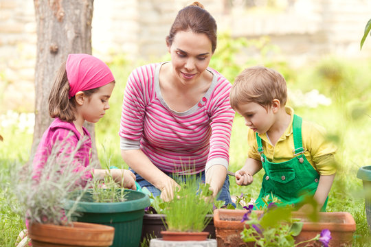 Kids And Mother Gardening