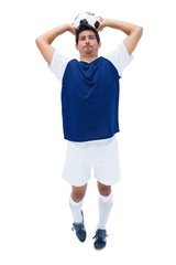 Football player in white throwing ball