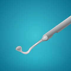 Dental spoon on blue background