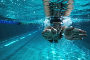 Athletic swimmer training on her own