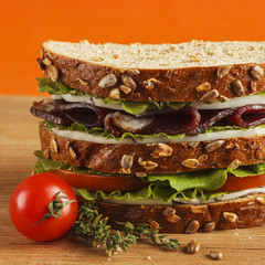 Sandwich on wood background