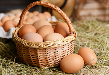 Eggs in wicker basket on table close-up