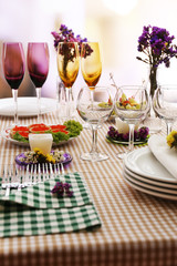 Buffet table with dishware waiting for guests