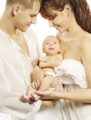 Family and new born baby, parents holding newborn child