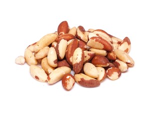 Heap of brasil nuts isolated on white background
