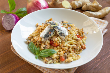 Fregola con sardine e zenzero, cucina sarda