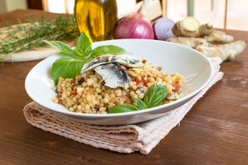 Fregola con sardine e zenzero, cucina sarda