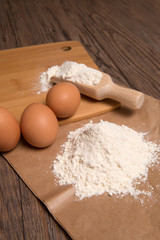Flour spoon and eggs