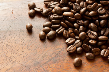 Coffee beans on wood background