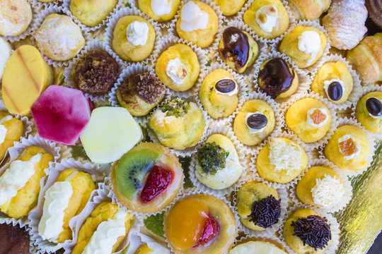 Various stuffed puffs with cream decorated