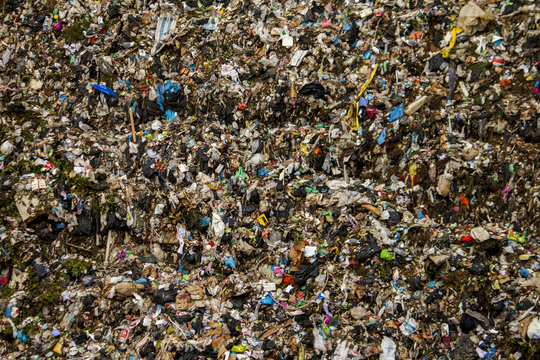 View of a massive trash dump site, result of the human activity.