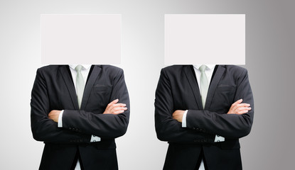 Businessman standing white paper face holding front of head