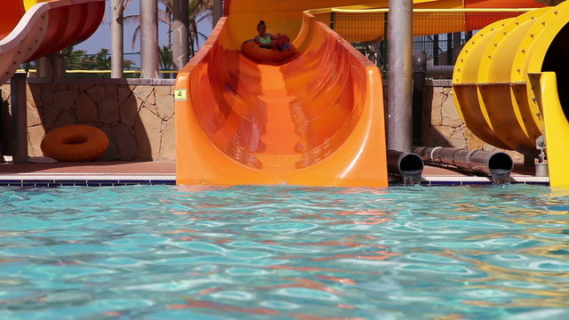 Children have fun with their grandpa in water park