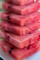 juicy, sweet slices of watermelon on a white plate