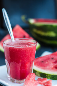 heart of the watermelon in a glass of smoothieon the board