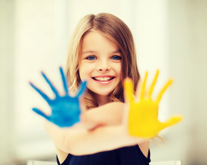 girl showing painted hands