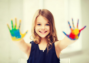 girl showing painted hands