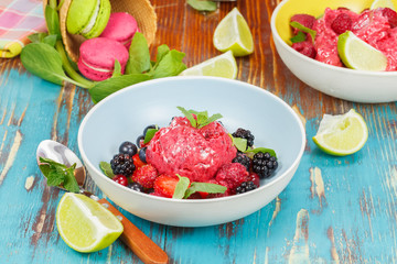 Berry yogurt ice cream with fresh berries and macarons