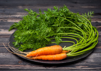 Raw carrots with leaves