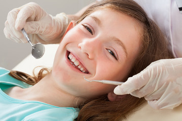 Happy Girl Undergoing Dental Treatment