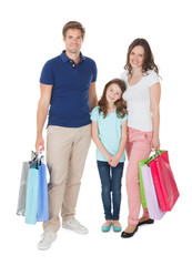 Portrait Of Smiling Family With Shopping Bags