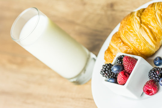 Healthy Breakfast With Croissant, Milk And Fresh Fruits