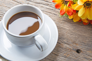 Cup of coffee on wooden table