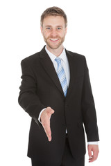 Confident Businessman Offering Handshake