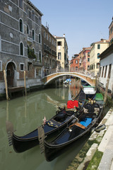 Fototapeta na wymiar Venetian Gondolas Venice Italy Canal