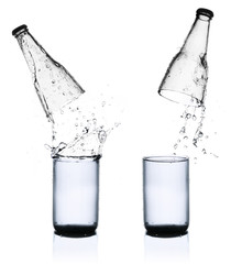 Fresh water splashing out of bottle, isolated on white backgroun