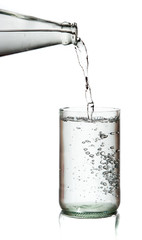 Cold water bottle pour water to glass on white background