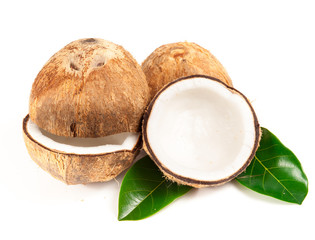 Coconut with green leaves isolated on white