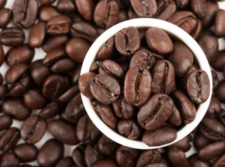 Closeup of coffee beans with focus on one