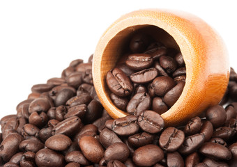 Closeup of coffee beans with focus on one