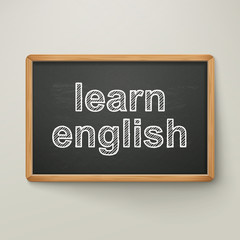 Fototapeta premium learn english on blackboard in wooden frame