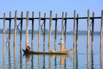 Local people fishing from a boat near U Bein Bridge, Amarapura,