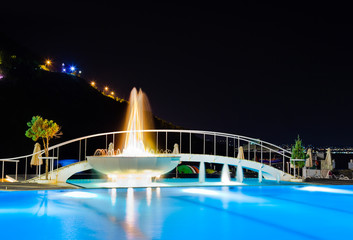 Water pool and fountain at night