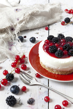 mini cheesecake with blackberries blueberries and red currant