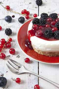 mini cheesecake with blackberries blueberries and red currant