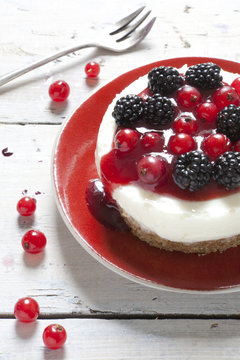 cheesecake with blackberries blueberries and red currant
