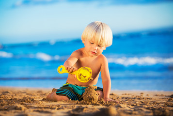 Young boy playing at the beach