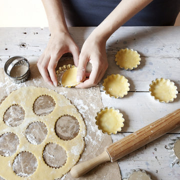 girl hands making shortcrust pastry for little tart