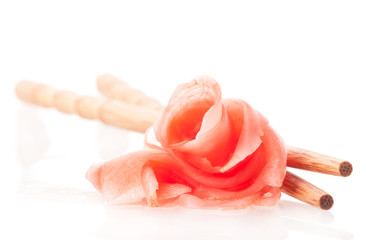 Picled Ginger and chopsticks isolated on white background