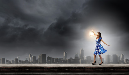 Fototapeta na wymiar Woman with lantern